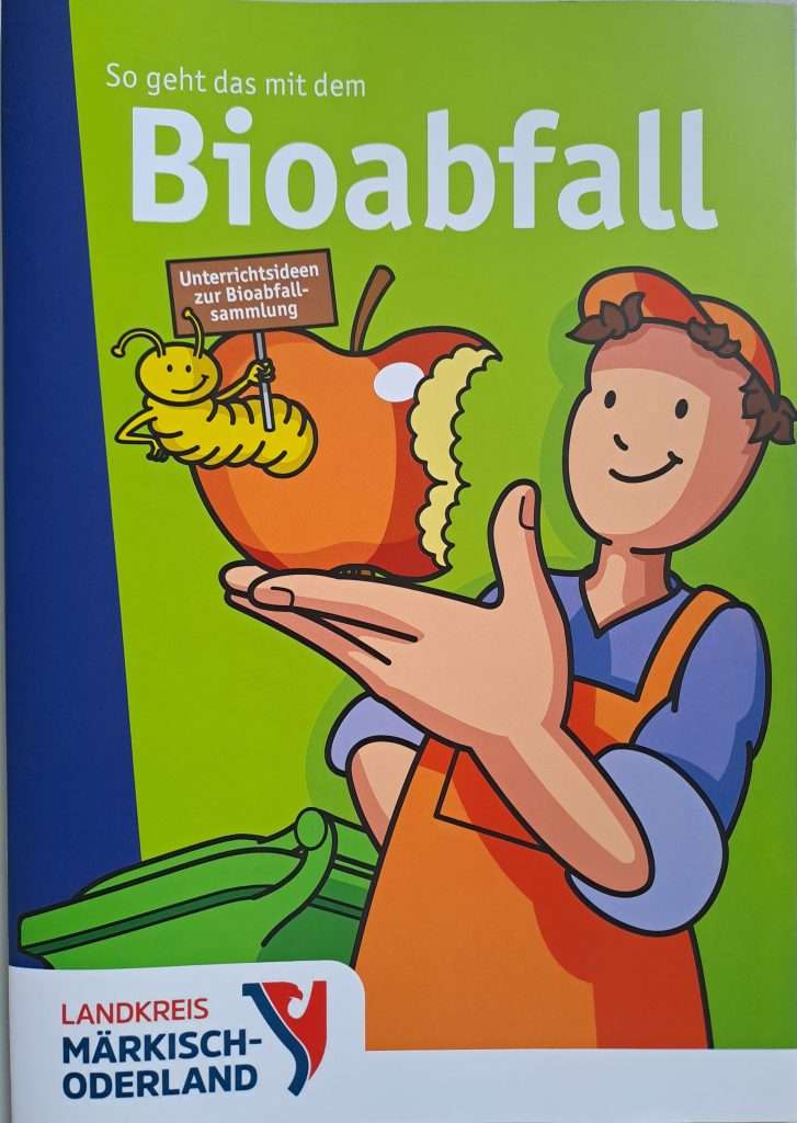 Titelblatt der Broschüre "So geht das mit dem Bioabfall". Zeichnung eines Müllwerkers, der einen angebissenen Apfel in der Hand hält. aus dem ein lustiger Wurm guckt, Repro: EMO